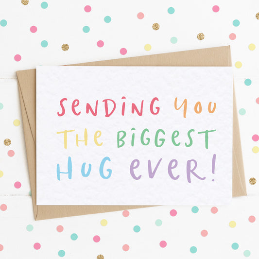 A vibrant A6 thinking of you card with colourful rainbow text and a message saying "Sending You The Biggest Hug Ever".