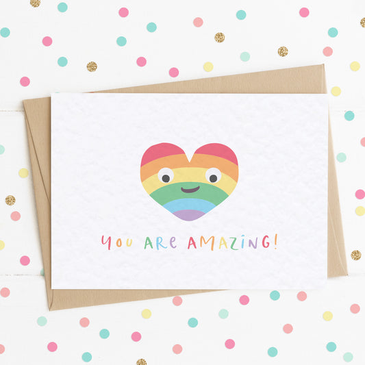 A cute A6 love card with a colourful smiling rainbow heart and a message saying "You Are Amazing".