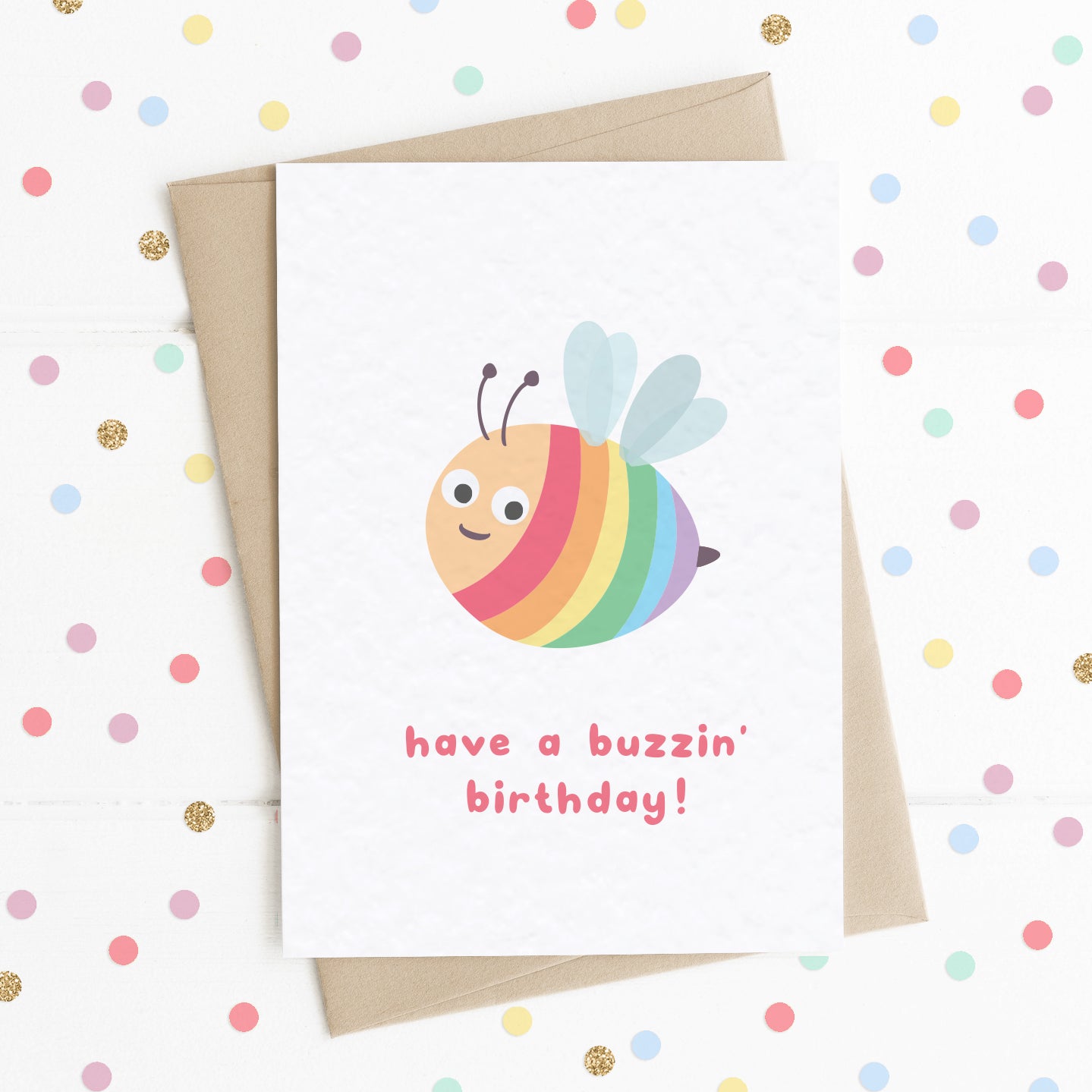 A fun birthday card with a smiling happy rainbow bee on it with the message "Have a Buzzin' Birthday".