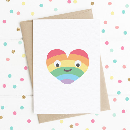 A cute A6 love card with a colourful smiling rainbow heart.