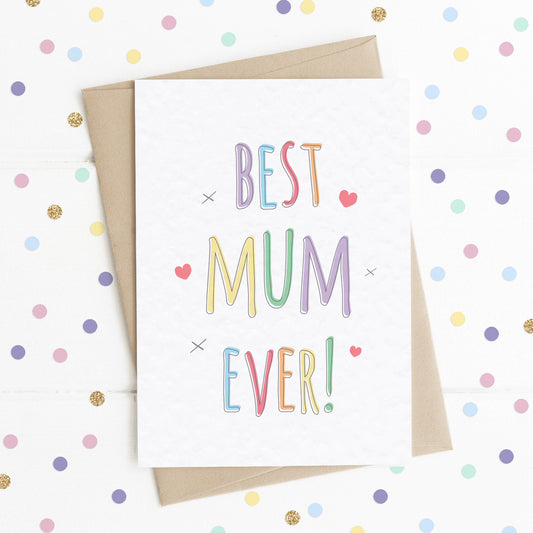 A fun colourful rainbow type A6 size card with the message "Best Mum Ever" surrounded by a few hearts and x kisses.