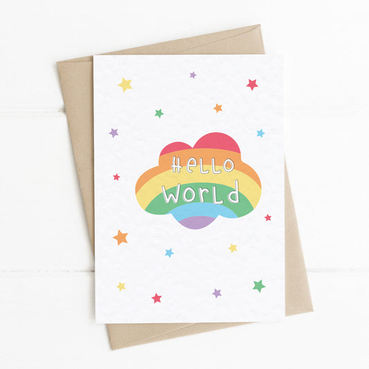 A Cute New Baby Card with a colourful rainbow cloud and a message saying "Hello World" surrounded by stars in complimenting rainbow colours.