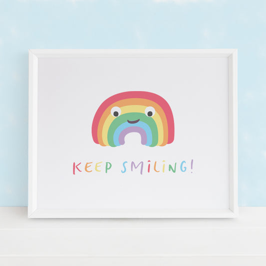 A cute positivity print with a smiling happy rainbow on it and the message "Keep Smiling".