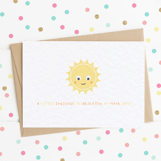 A cute card with a smiling happy sun on it with the message "A Little Sunshine To Brighten Up Your Day".