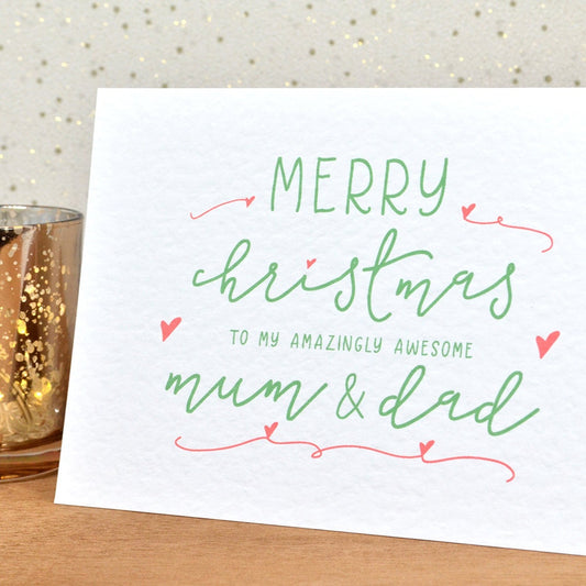 A fun and thoughtful Christmas card in festive colours and the message "Merry Christmas To My Amazingly Awesome Mum & Dad".