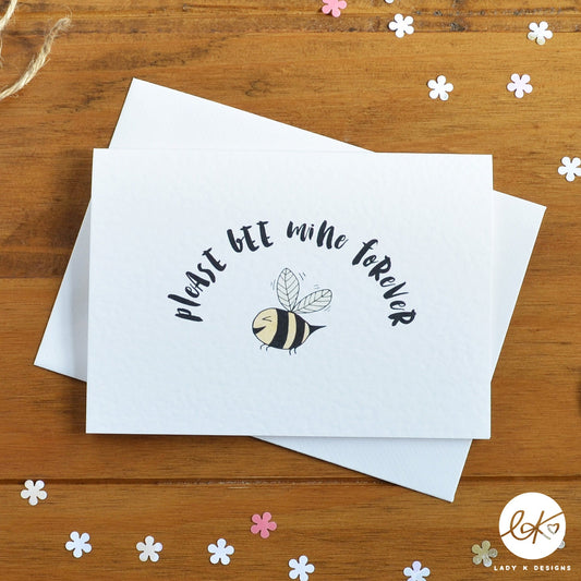An A6 size card, with a cute smiling happy bee and the message "Please Bee Mine Forever".