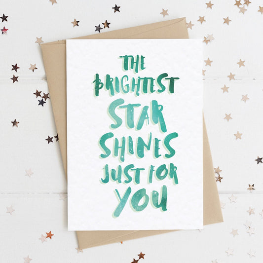 A sweet positivity card with text in colours inspired by the northern lights/hygge and the message, "THE BRIGHTEST STAR SHINES JUST FOR YOU".