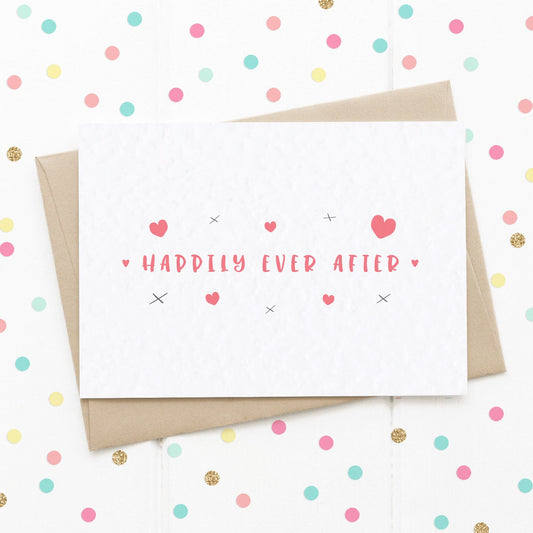 A Fairytale Wedding Card surrounded by cute red hearts and x kisses with the message "Happily Ever After".