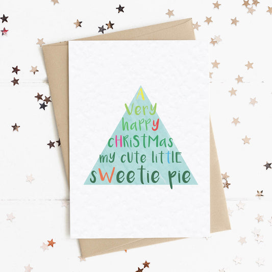 A fun and thoughtful card in festive Christmas tree design and colours with the message "A Very Merry Christmas My Cute Little Sweetie Pie".