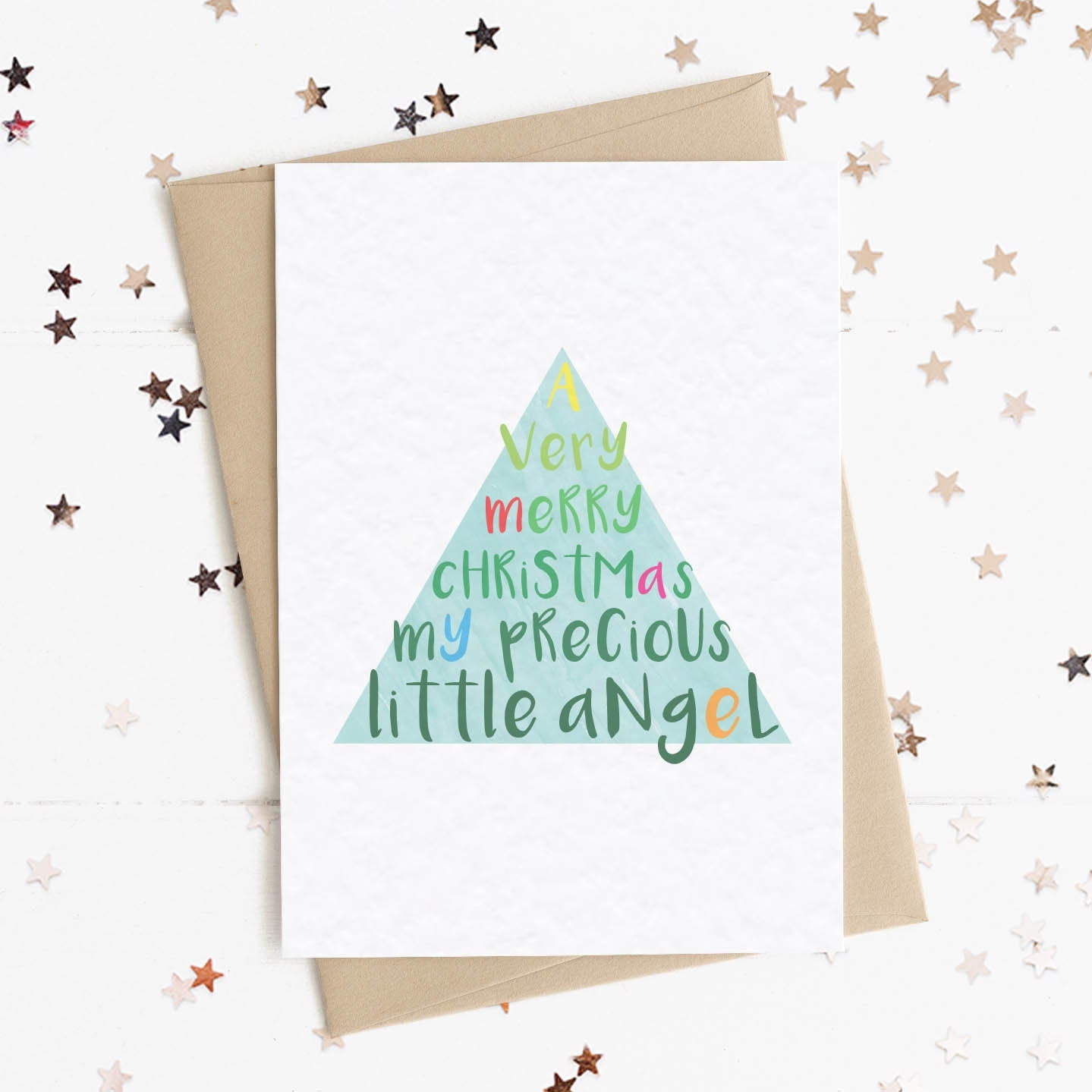 A fun and thoughtful card in festive Christmas tree design and colours with the message "A Very Merry Christmas My Precious Little Angel".