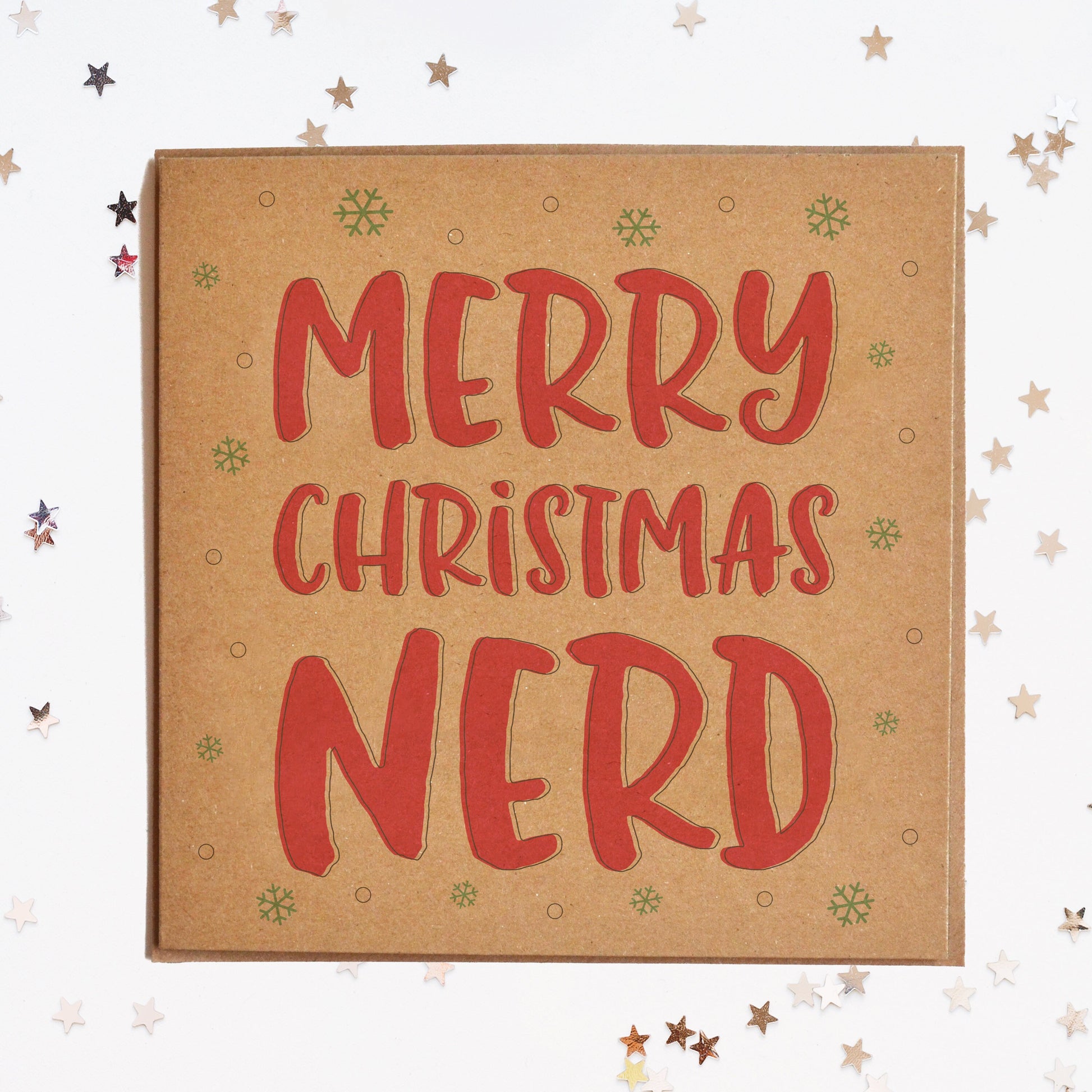 A funny Christmas card in festive colours and the message "Merry Christmas Nerd" surrounded by decorative snowflakes.