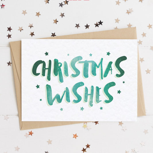 A celestial Christmas card with a stars and text in colours inspired by the northern lights/hygge and the message, "CHRISTMAS WISHES".