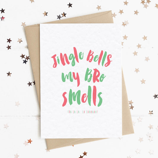 A funny Christmas card in festive colours and the message "Jingle Bells My Bro Smells".