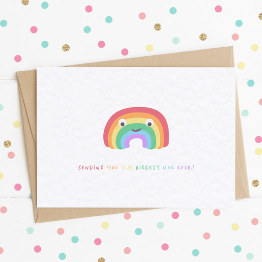 A cute positivity card with a smiling happy rainbow on it and the message "SENDING YOU THE BIGGEST HUG EVER!"