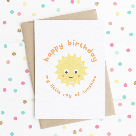 A cute birthday card with a smiling happy sun on it with the message "Happy Birthday My Little Ray Of Sunshine".