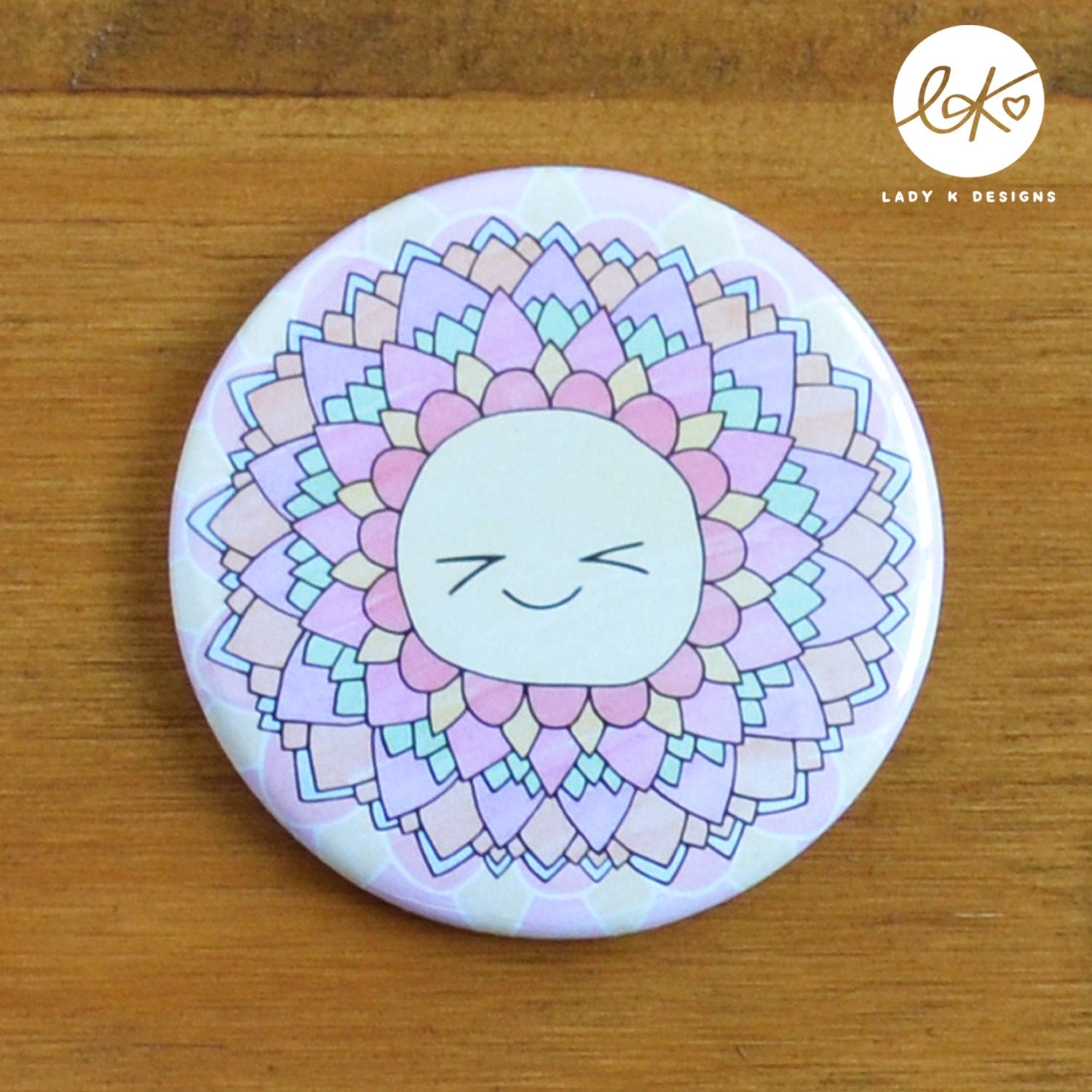 A cute 58mm Pocket Mirror with a smiling happy flower design. The characters name is Rainbow.
